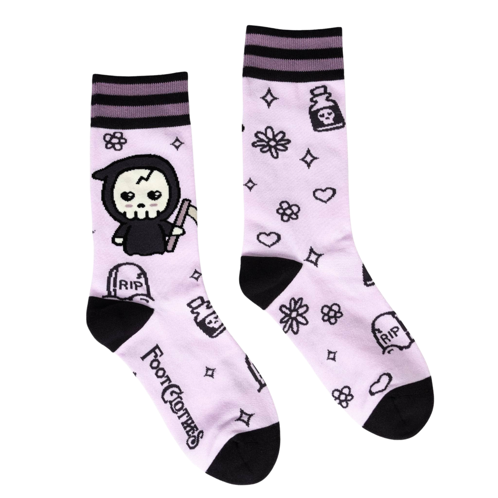 
                      
                        A pair of socks depicting a cartoon version of the grim reaper. Pastel pink socks, cute pattern. Black toes, cuff and heel. 
                      
                    