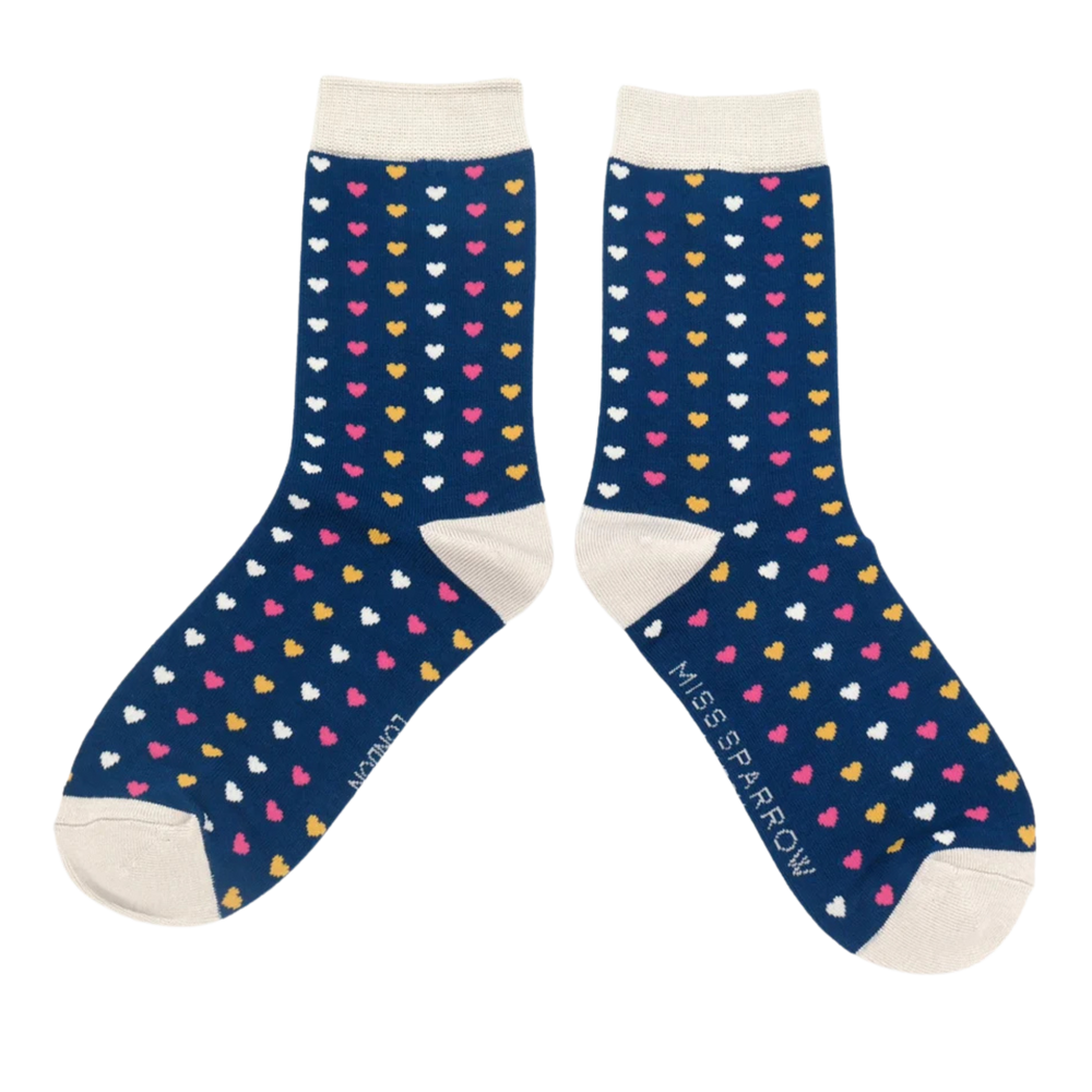 
                      
                        A pair of bamboo socks with a heart pattern. Blue legs, white toe, heel and cuff. 
                      
                    