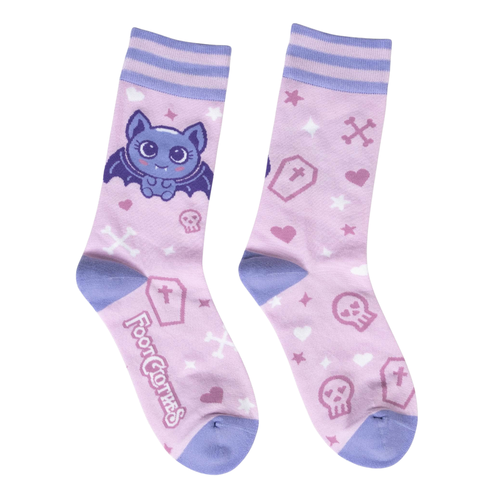 
                      
                        Widdle Bat Guy Socks. A pair of socks with a cute bat motif. Pink legs, light purple heel, toe and cuff. 
                      
                    