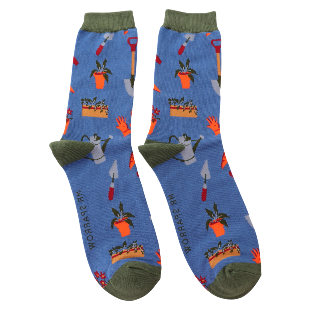 
                      
                        A pair of socks featuring gardeners tools, blue legs, grey heel, toe and cuff. 
                      
                    