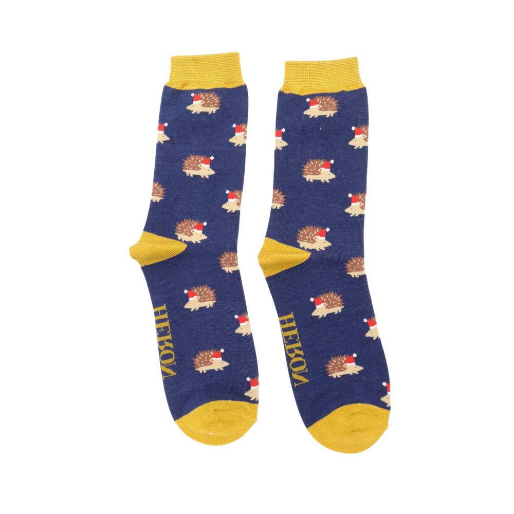 
                      
                        A pair of socks depicting a festive hedgehog pattern. Dark blue legs, yellow heel, toe and cuff. 
                      
                    