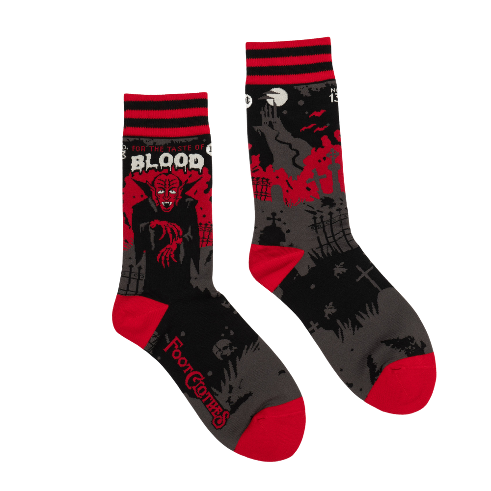 
                      
                        Dracula's Bloodlust Socks. A pair of socks depicting Dracula and a vampire slogan. Red cuff, heel and toe.
                      
                    