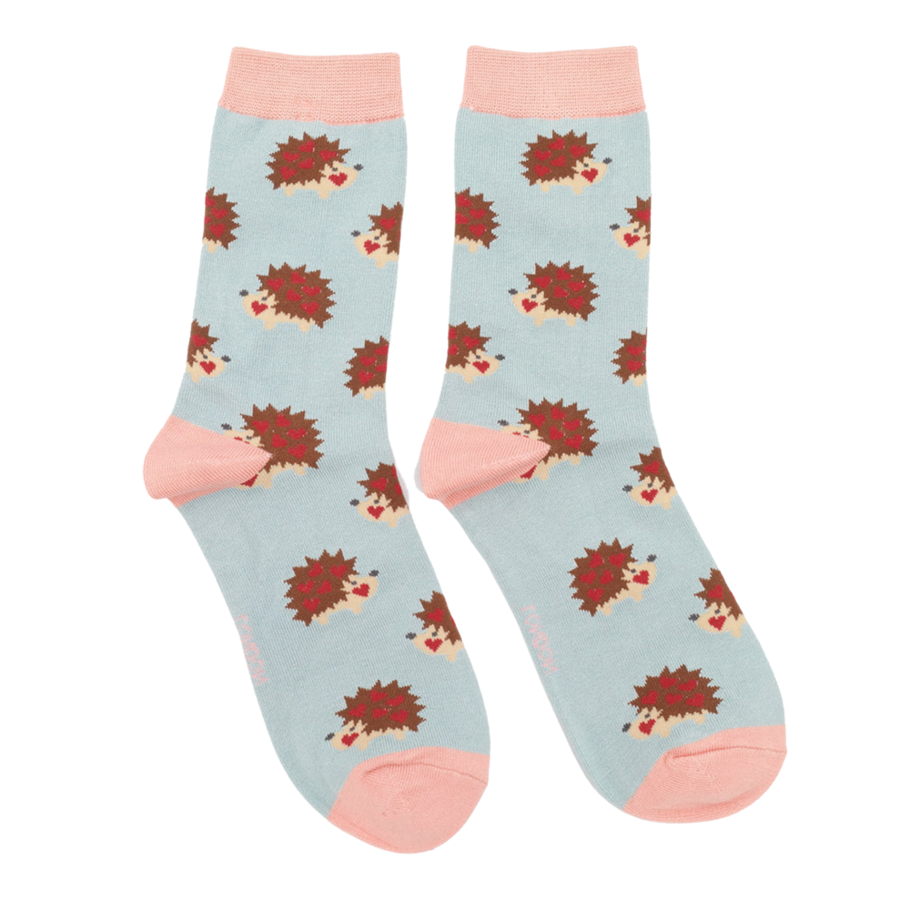 
                      
                        Hearty Hedgehogs Bamboo Socks. A pair of socks with a hedgehog motif. Light blue legs, pink heel, toe and cuff. 
                      
                    