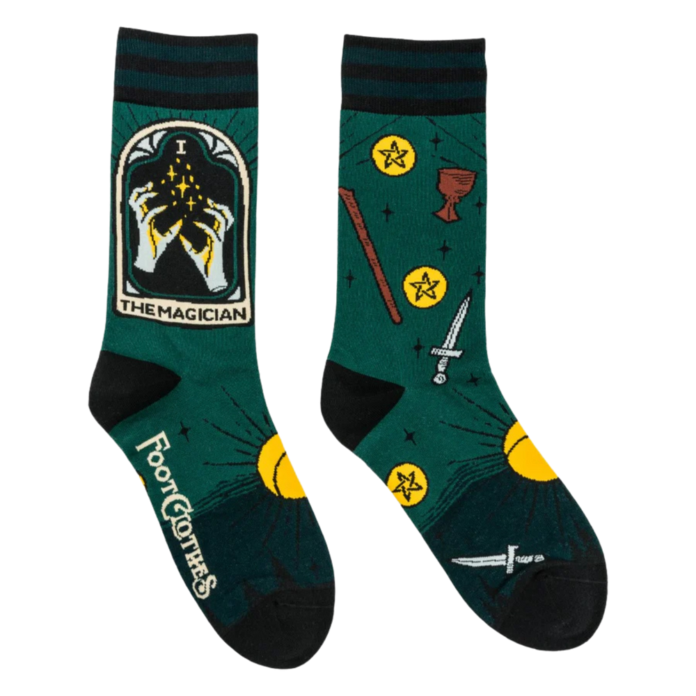 
                      
                        The Magician Tarot Nouveau Crew Socks. A pair of socks featuring the Magician tarot card. Green legs, black heel, toe and cuff. 
                      
                    