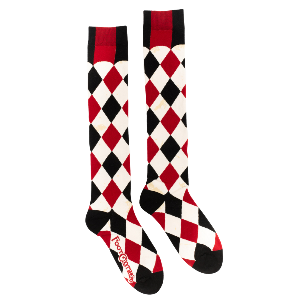 
                      
                        Haunting Harlequin Knee High Socks. A pair of knee high socks with a harlequin pattern. Black, white and red. 
                      
                    