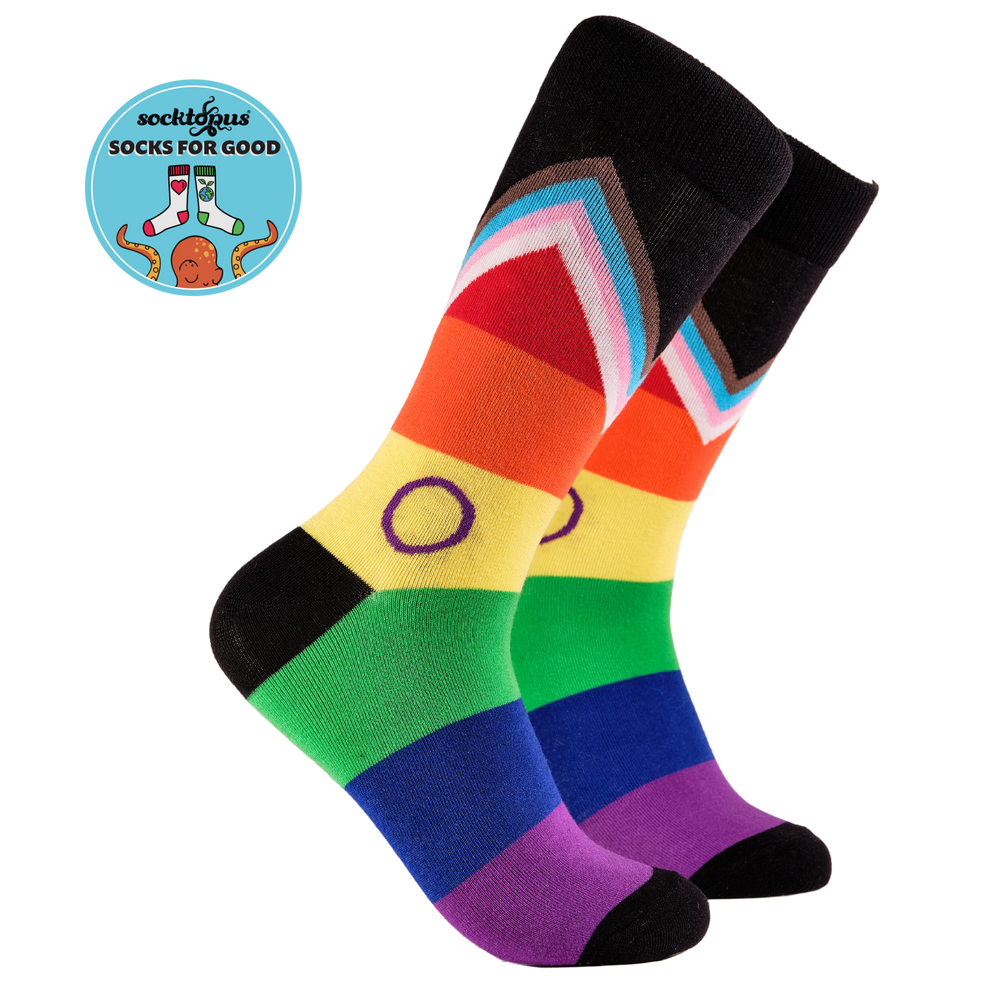 A pair of rainbow socks with an LGBTQ+ motif. 
