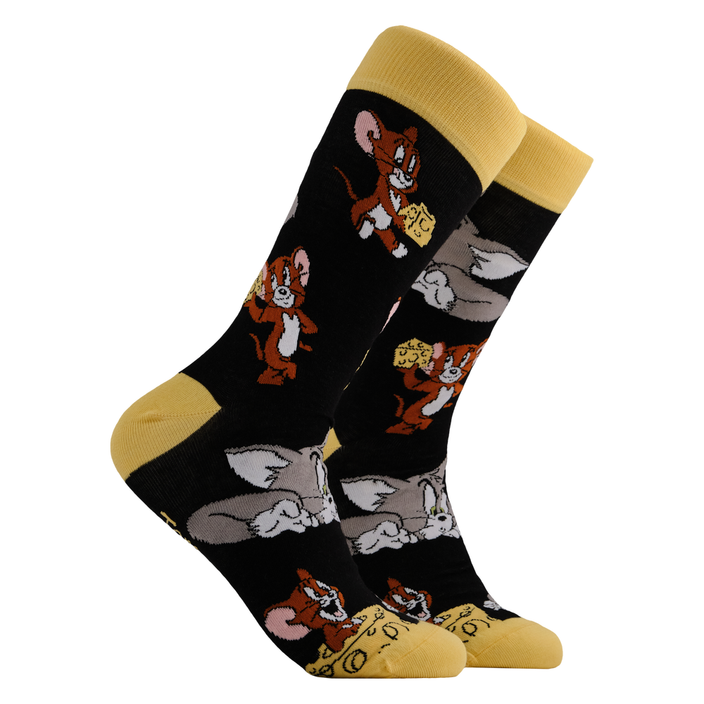 
                      
                        Tom and Jerry Socks - Cheese. A pair of socks depicting the lovable duo of Tom and Jerry. Black legs, yellow toe, cuff and heel. 
                      
                    