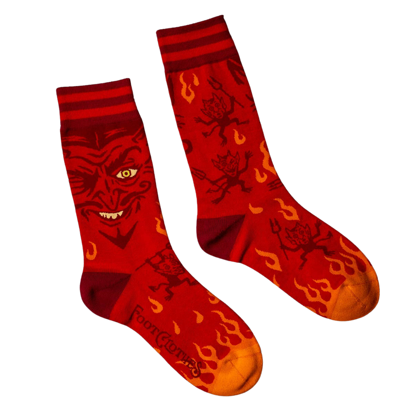 
                  
                    Vintage Devil Socks. A pair of socks inspired by vintage magic posters with a picture of the devil. Orange flame toes, red heel and cuff. 
                  
                