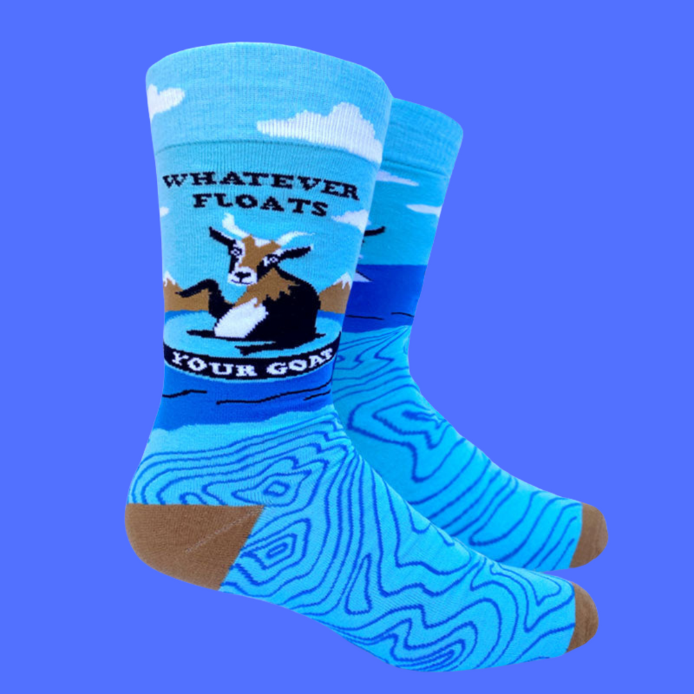 A pair of socks depicting a floating goat and a fun slogan. Brown toes, cuffs and heel.