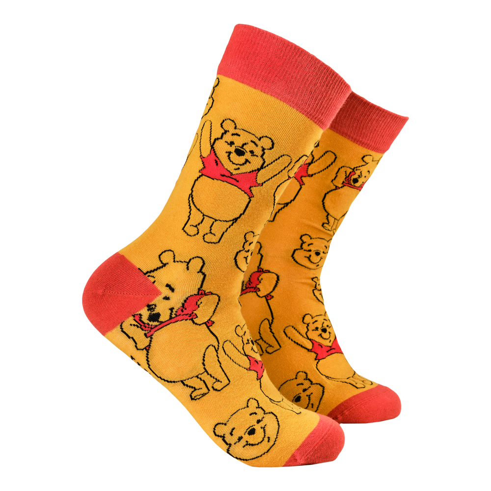 
                      
                        Disney's Winnie The Pooh Socks. A pair of socks featuring Winne the Pooh. Yellow legs, red toe, cuff and heel. 
                      
                    