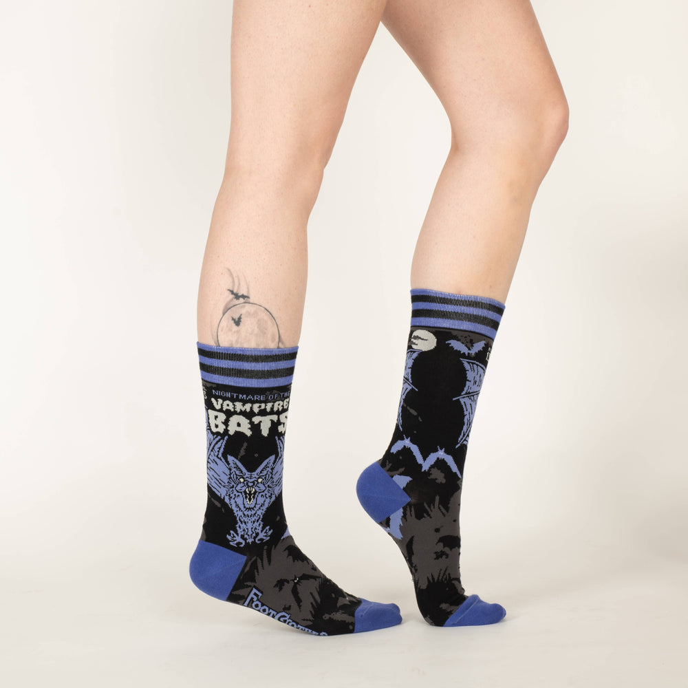 
                      
                        A pair of socks depicting a scary looking vampire bat. Blue toes, cuff and heel. 
                      
                    