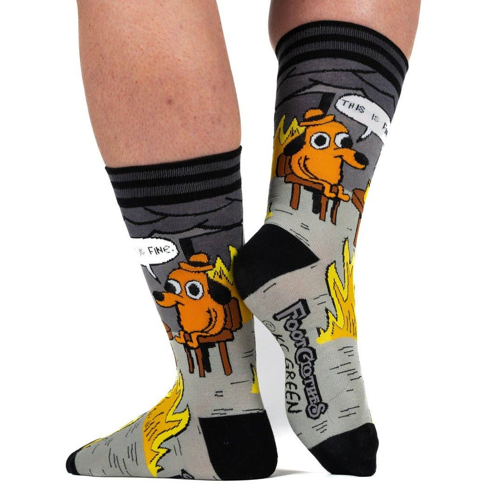 
                      
                        A model wearing a pair of socks with a KC Green cartoon. Grey and yellow legs. 
                      
                    