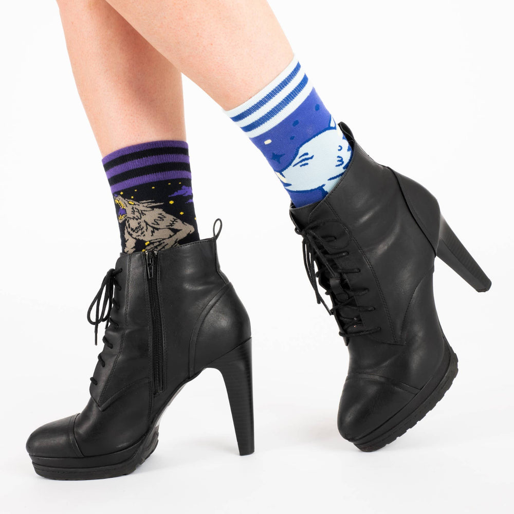 
                  
                    Model wearing a pair of socks with a cool cute werewolf motif. Cream toes, heel and cuff. 
                  
                