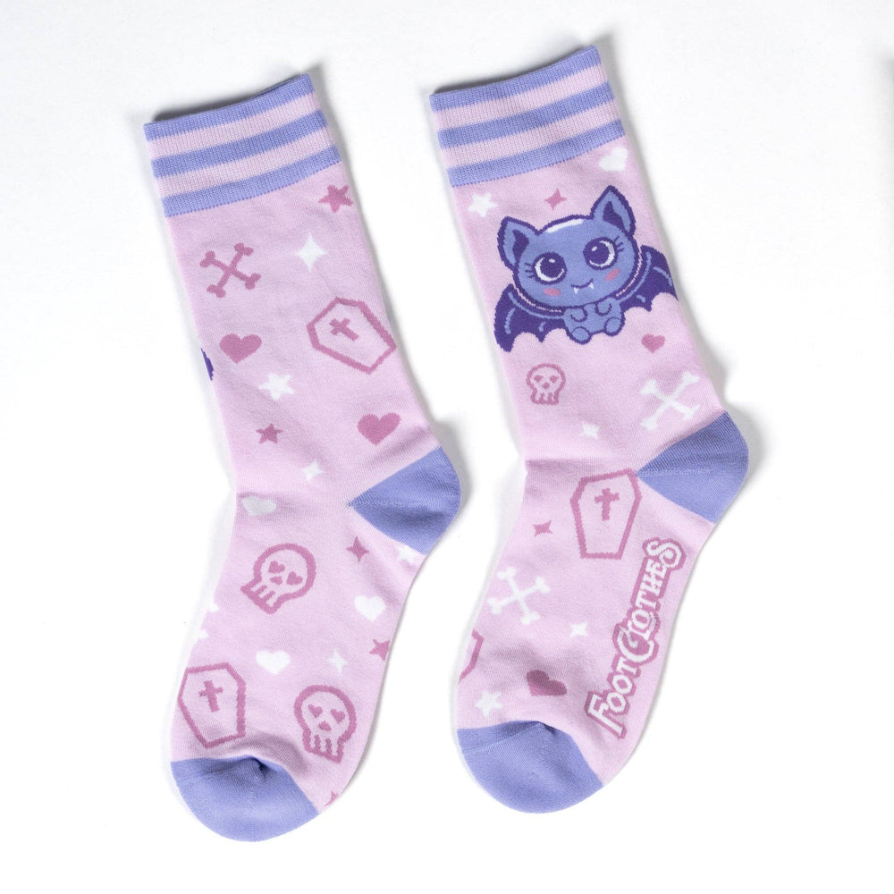 
                      
                        A pair of socks with a cute bat motif. Pink legs, light purple heel, toe and cuff. 
                      
                    