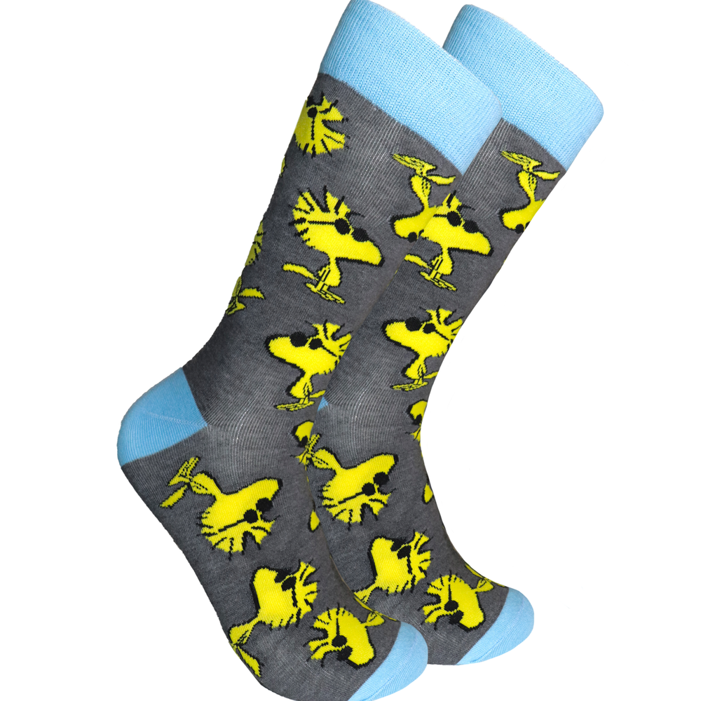 Peanuts Socks - Woodstock. A pair of socks depicting the cool dude Woodstock. Grey legs, blue cuff, heel and toe.