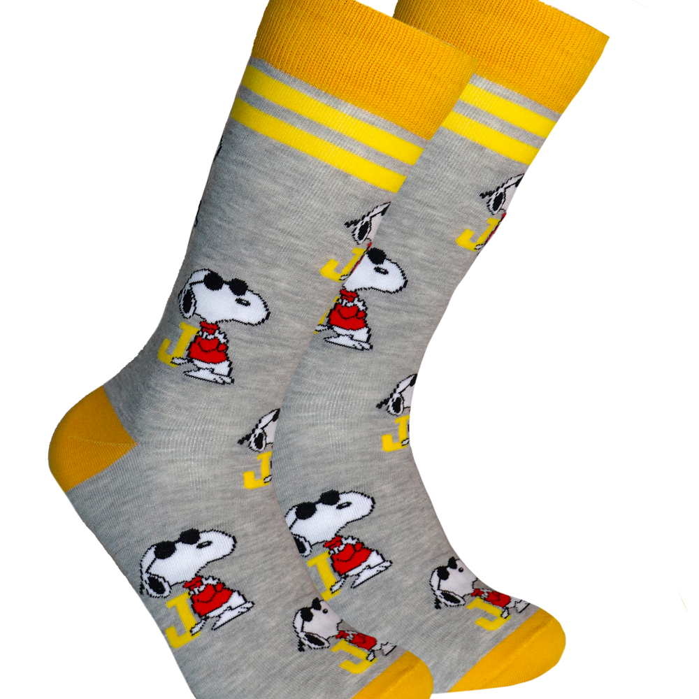 Peanuts Socks - Snoopy Joe Cool. A pair of socks depicting Snoopy as Joe Cool. Grey legs, yellow cuff, heel and toe.