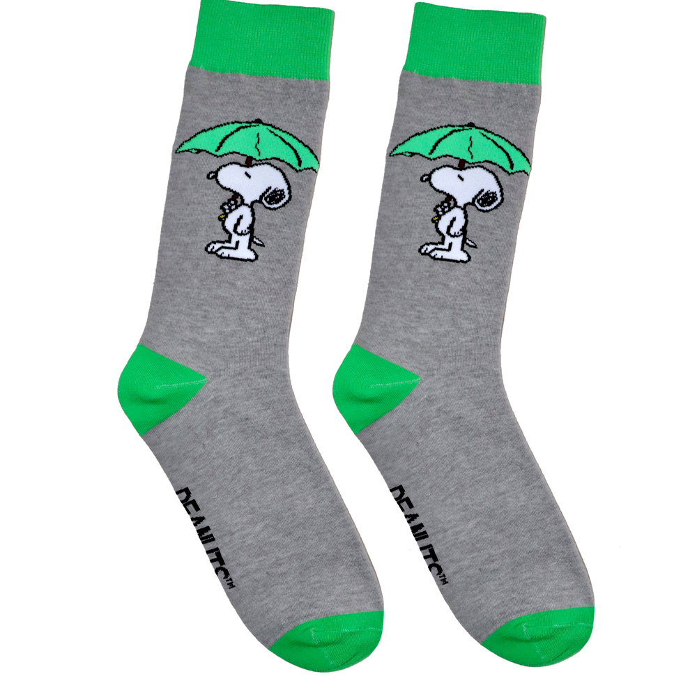 A pair of socks depicting snoopy with an umbrella. Grey legs, green cuff, heel and toe.
